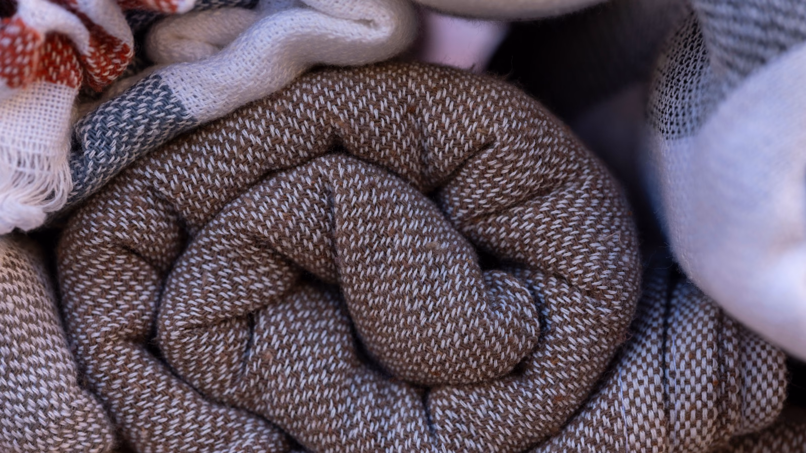 Featured image for Throw Blankets Compared, From Sherpa to Knit
