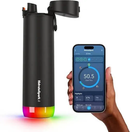 Black smart water bottle with an illuminated base beside its companion phone app